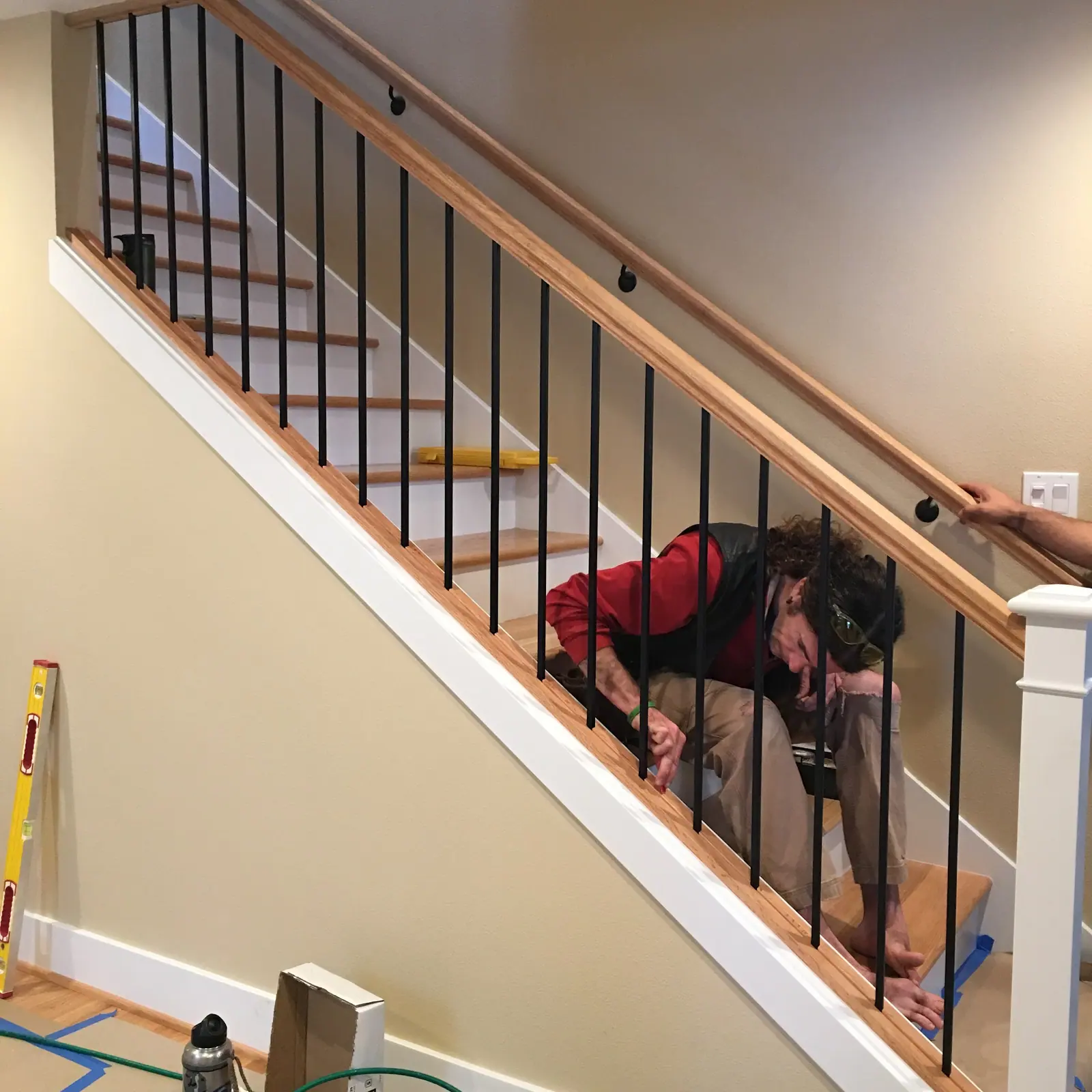 Person working at a stair railing
